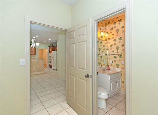 interior space featuring light tile patterned flooring and sink