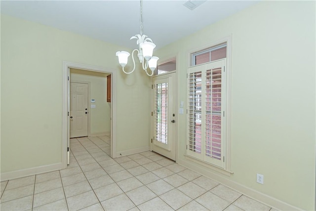 entryway featuring an inviting chandelier