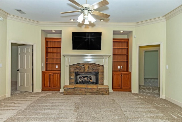 unfurnished living room with a fireplace, carpet floors, ornamental molding, and ceiling fan