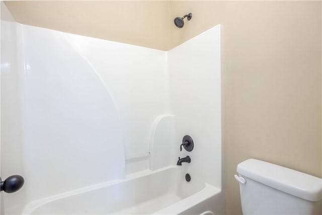 bathroom with toilet and shower / bathtub combination