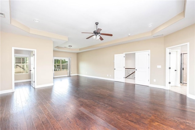 167 Vinci Way, Auburn, AL 36830 - unfurnished living room with a tray ceiling, a ceiling fan, dark wood finished floors, and recessed lighting