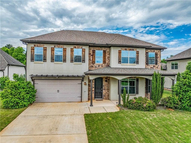 167 Vinci Way, Auburn, AL 36830 - traditional-style house featuring concrete driveway, covered porch, an attached garage, a front yard, and stucco siding