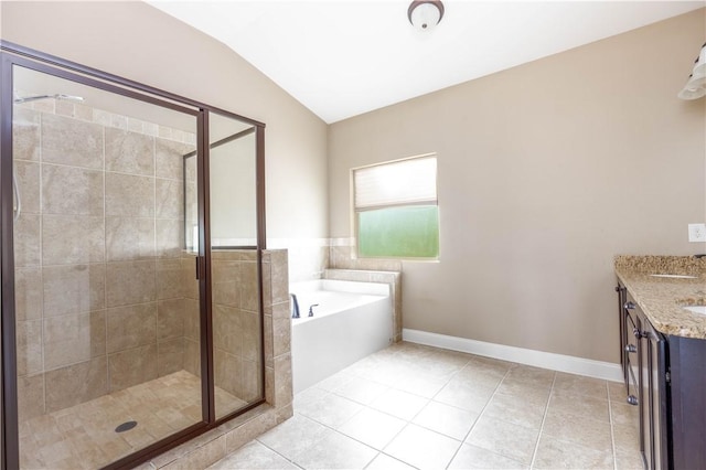 full bathroom featuring a shower stall, a garden tub, tile patterned flooring, vaulted ceiling, and vanity