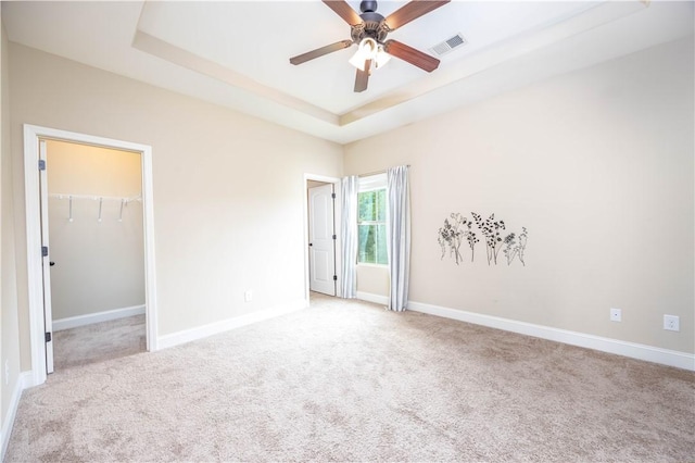 bathroom featuring baseboards, a ceiling fan, and vanity