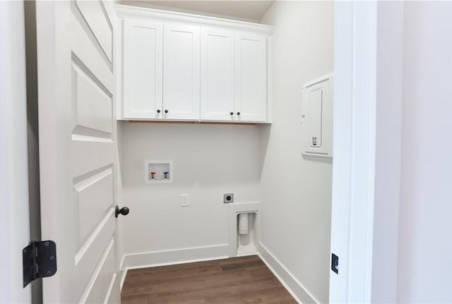 laundry area featuring hookup for an electric dryer, dark wood finished floors, baseboards, hookup for a washing machine, and cabinet space