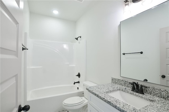 full bath featuring toilet, vanity, and shower / washtub combination