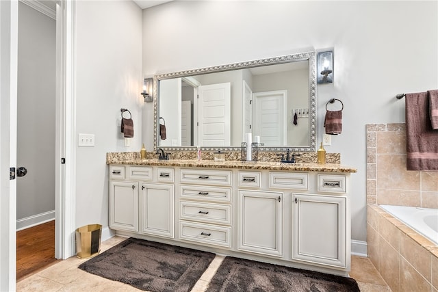 4164 Creekview Ct, Auburn, AL 36832 - bathroom with double vanity, a bath, and tile patterned floors