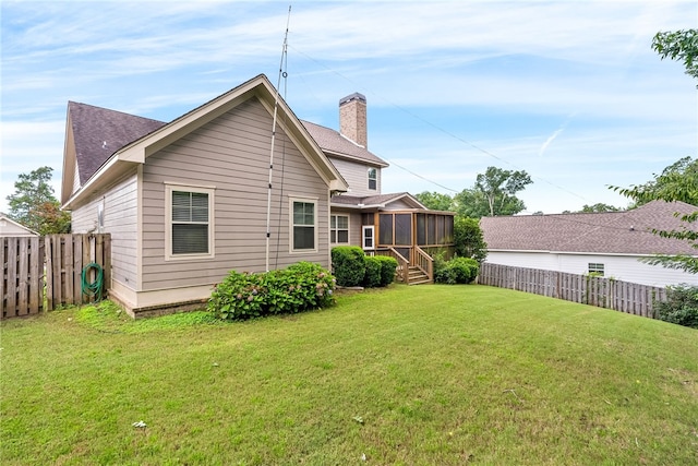 4164 Creekview Ct, Auburn, AL 36832 - back of house with a sunroom, a chimney, a fenced backyard, and roof with shingles