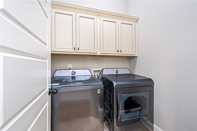 4164 Creekview Ct, Auburn, AL 36832 - laundry area with washer and dryer and cabinet space