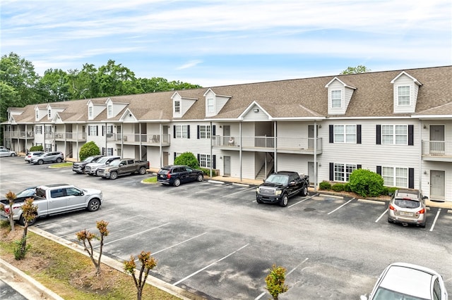 303 N Ross St Unit 104, Auburn, AL 36830 - uncovered parking lot featuring a residential view
