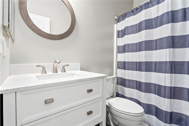 303 N Ross St Unit 104, Auburn, AL 36830 - bathroom with toilet, vanity, and a shower with curtain