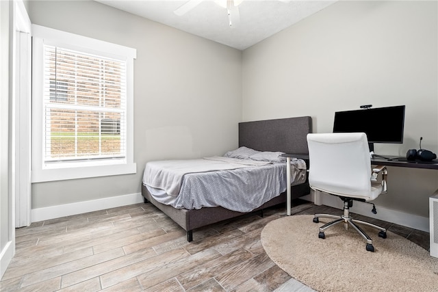 303 N Ross St Unit 104, Auburn, AL 36830 - bedroom featuring wood finished floors, baseboards, and an office area