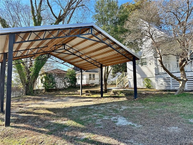 view of vehicle parking with a carport