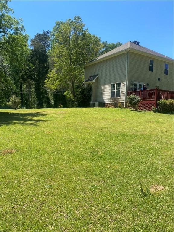 view of yard with a wooden deck