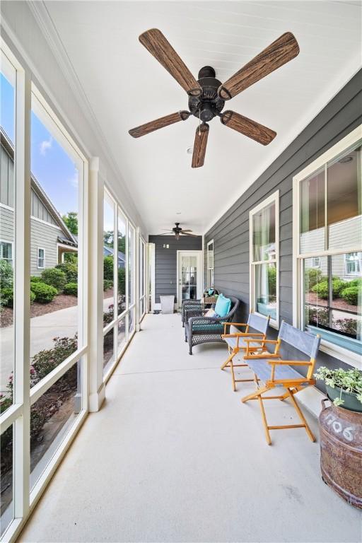 3412 Double Eagle Ln, Opelika, AL 36801 - sunroom featuring a ceiling fan and carpet flooring