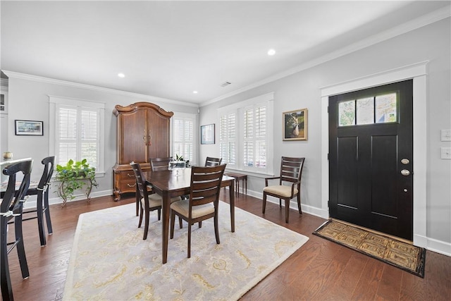 3412 Double Eagle Ln, Opelika, AL 36801 - dining area with baseboards, recessed lighting, dark wood-style floors, and crown molding
