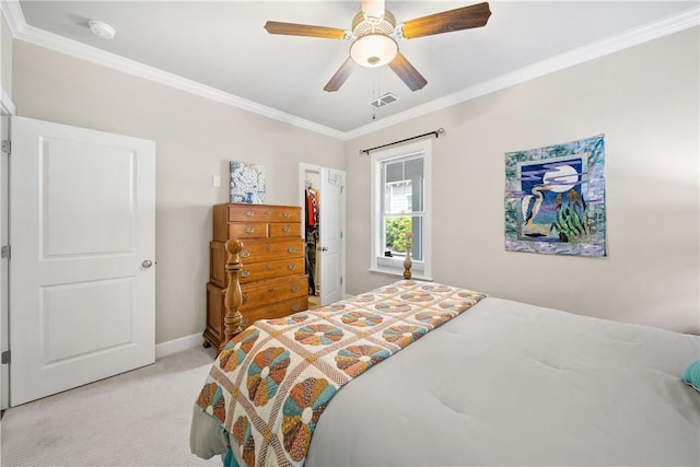 3412 Double Eagle Ln, Opelika, AL 36801 - bedroom with light carpet, ornamental molding, a ceiling fan, a closet, and a spacious closet
