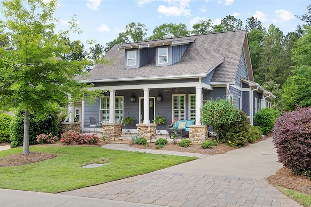 3412 Double Eagle Ln, Opelika, AL 36801 - view of front facade with a porch, a front lawn, ceiling fan, a shingled roof, and stone siding