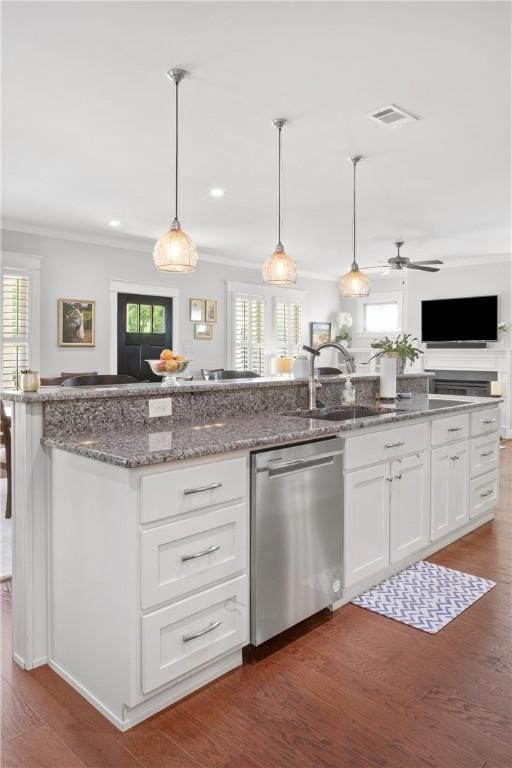 3412 Double Eagle Ln, Opelika, AL 36801 - kitchen with stainless steel dishwasher, a sink, white cabinets, stone countertops, and open floor plan