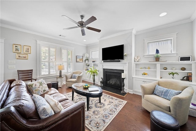 3412 Double Eagle Ln, Opelika, AL 36801 - living room featuring a fireplace with flush hearth, ceiling fan, ornamental molding, recessed lighting, and wood finished floors