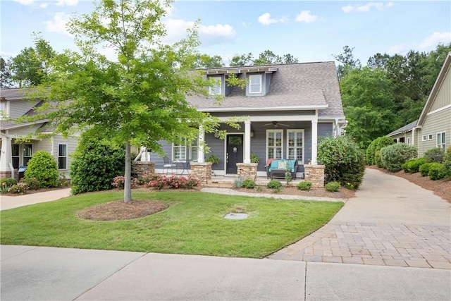 3412 Double Eagle Ln, Opelika, AL 36801 - craftsman-style home featuring a front lawn, a porch, roof with shingles, ceiling fan, and stone siding