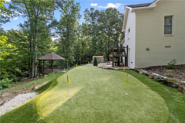 255 Hedgerow Cir, Auburn, AL 36830 - view of yard with a putting area, a gazebo, a wooden deck, and a patio area