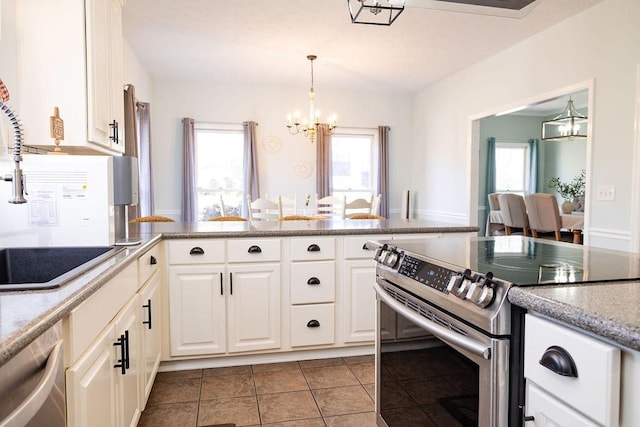 255 Hedgerow Cir, Auburn, AL 36830 - kitchen featuring stainless steel appliances, a chandelier, white cabinets, and plenty of natural light