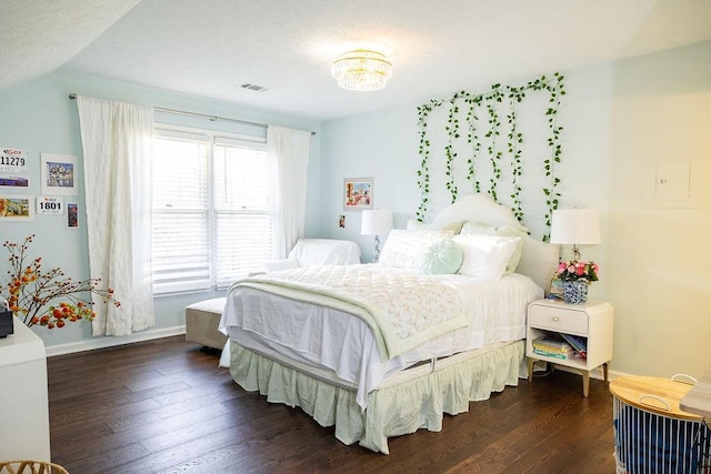 255 Hedgerow Cir, Auburn, AL 36830 - bedroom featuring dark wood-type flooring, a chandelier, and lofted ceiling