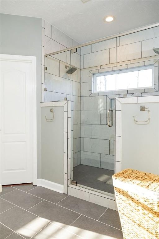 255 Hedgerow Cir, Auburn, AL 36830 - full bathroom featuring tile patterned flooring, a shower stall, and recessed lighting