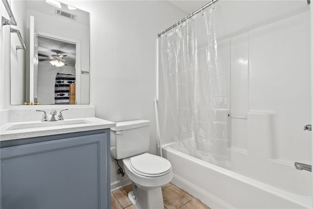 full bathroom featuring vanity, shower / tub combo with curtain, tile patterned floors, and toilet