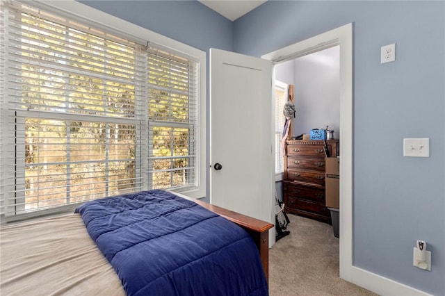 bedroom with light colored carpet