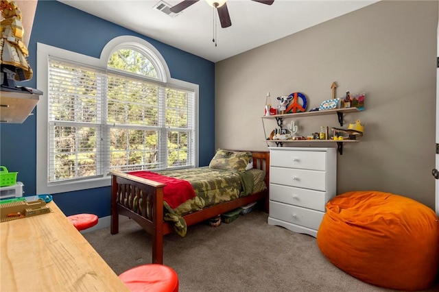 bedroom with ceiling fan and carpet flooring