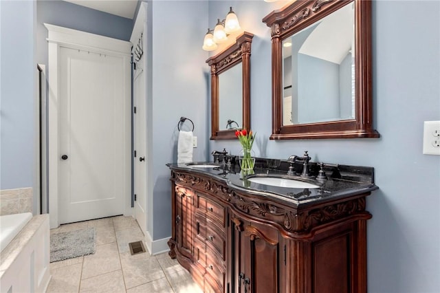 bathroom featuring tile patterned flooring and vanity