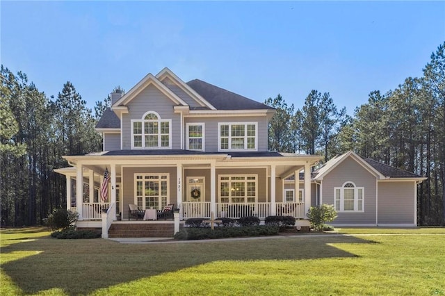 view of front of home featuring covered porch and a front lawn