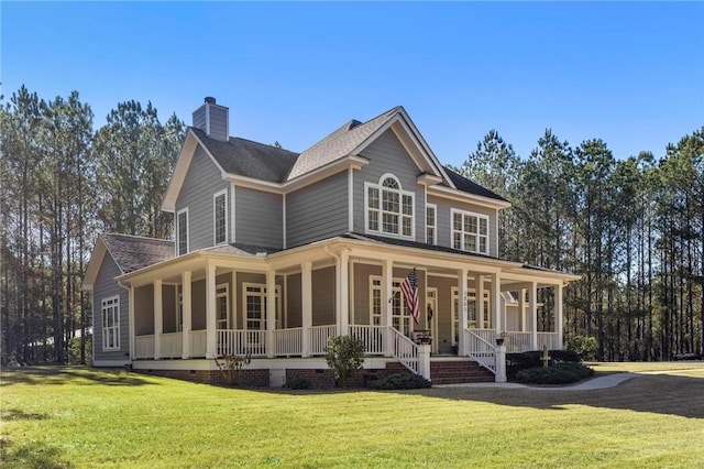 back of property with a yard and a porch