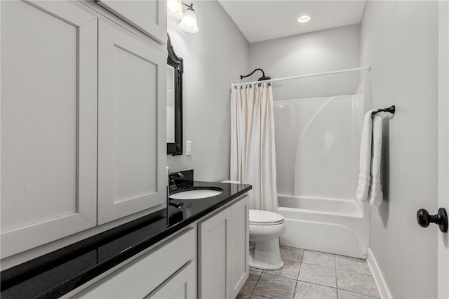 full bathroom featuring toilet, vanity, and shower / bathtub combination with curtain