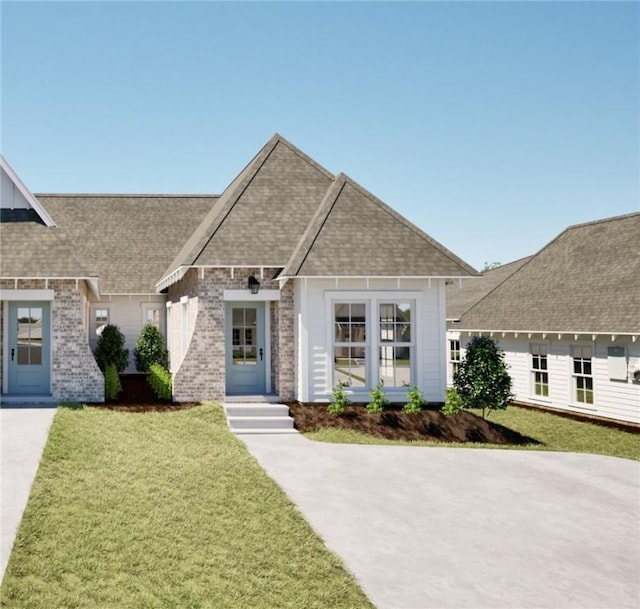 03242 Bradley Ln, Auburn, AL 36830 - view of front of home featuring a front yard, roof with shingles, and brick siding