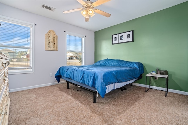 carpeted bedroom featuring ceiling fan