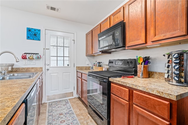 kitchen with sink and black appliances