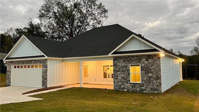 view of front facade with a garage and a front lawn