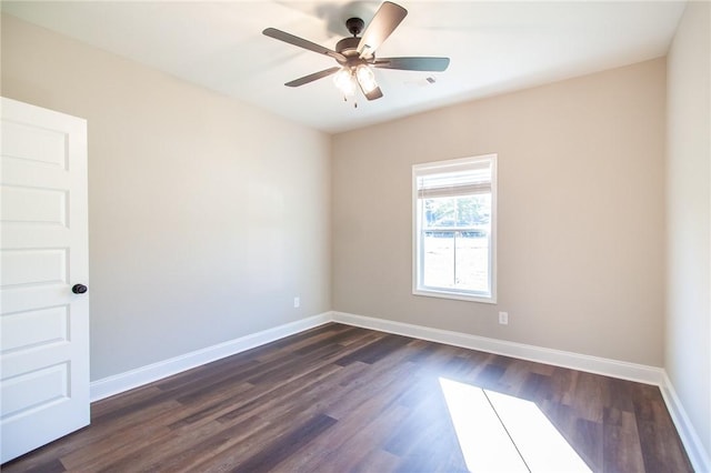 unfurnished room featuring ceiling fan and dark wood-type flooring