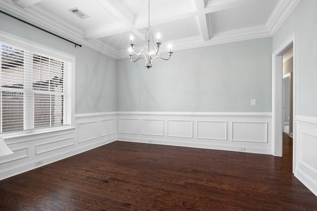 unfurnished room featuring coffered ceiling, dark wood-type flooring, an inviting chandelier, and beam ceiling