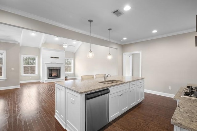 kitchen featuring sink, hanging light fixtures, dishwasher, an island with sink, and white cabinets