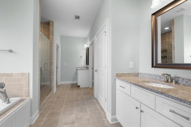 bathroom with tile patterned floors, vanity, and plus walk in shower