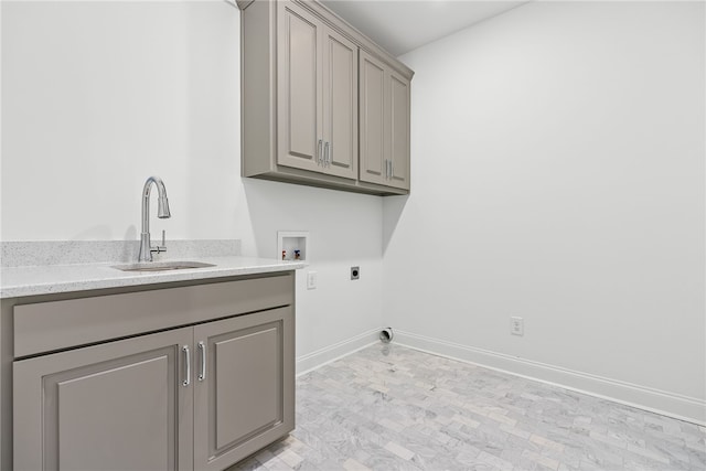 clothes washing area with cabinets, sink, washer hookup, and hookup for an electric dryer