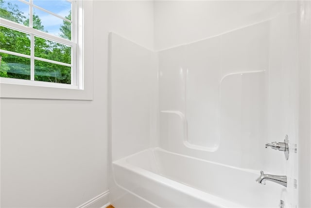 bathroom featuring  shower combination