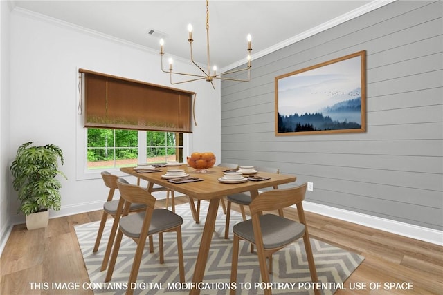 dining space featuring wood walls, light wood-type flooring, and crown molding