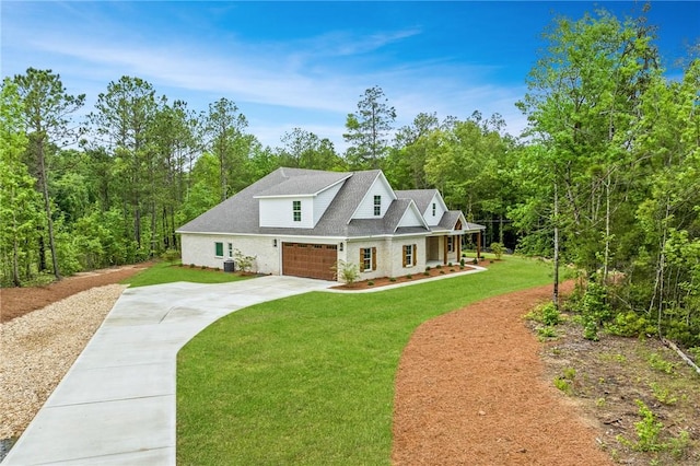 view of front facade with a front yard and a garage