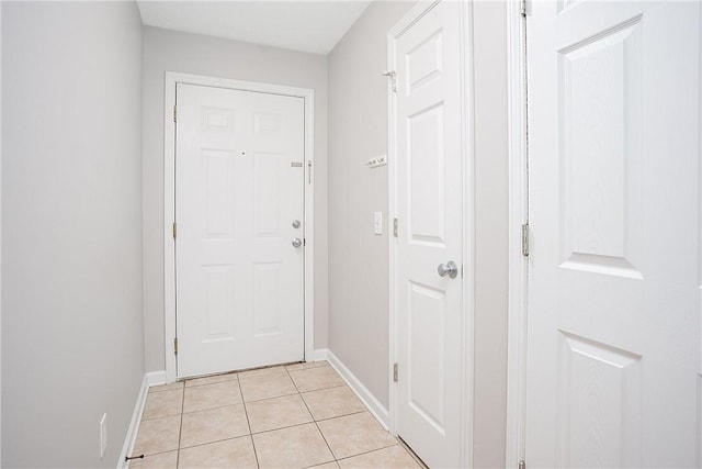 1385 S Donahue Dr Unit 4201, Auburn, AL 36832 - doorway to outside featuring light tile patterned flooring and baseboards