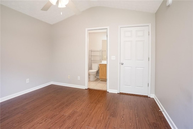 1385 S Donahue Dr Unit 4201, Auburn, AL 36832 - unfurnished bedroom with wood finished floors, vaulted ceiling, ensuite bathroom, and ceiling fan